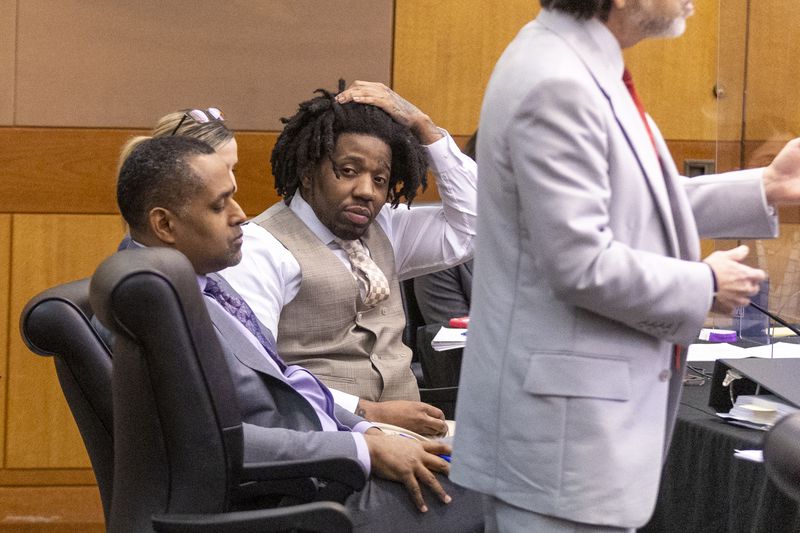 Atlanta rapper YFN Lucci, whose real name is Rayshawn Bennett, sits with his attorneys during his plea deal Tuesday in a Fulton County Courtroom. (Steve Schaefer/steve.schaefer@ajc.com)