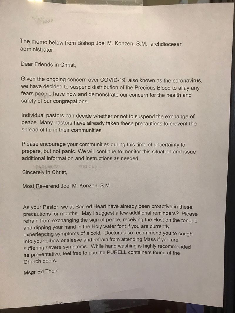 This letter in reference to coronavirus was posted on the doors to the entrance of Basilica of the Sacred Heart of Jesus, a Catholic Church on Peachtree Street, on Sunday, March 1, 2020. The letter was also read to the congregation and applies to all parishes in the Atlanta archdiocese. (Photo: Ligaya Figueras/AJC)
