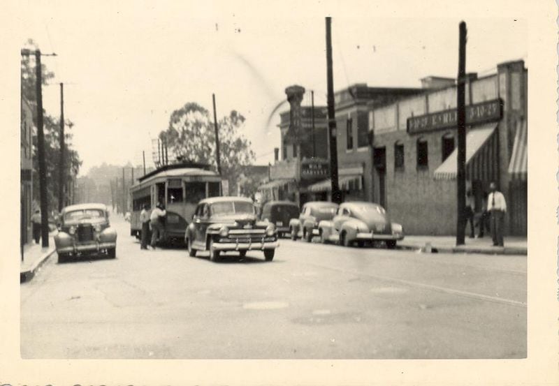 The Ashby Theater can be seen in the background of this image from the 1940s. It opened in the Washington Park neighborhood in the 1930s a part of the Bailey's chain of movie theaters that catered to Black audiences. In 2020, the dilapidated theater, which still retains its distinctive marquee, was placed on the Georgia Trust for Historic Preservation’s list of 10 Places in Peril. This photo was taken from the vantage point of Hunter Street (today's Martin Luther King Jr. Drive) with Ashby Street (today's Joseph Lowery Jr. Boulevard) crossing it in the foreground. (Skip Mason Archives; used with permission)