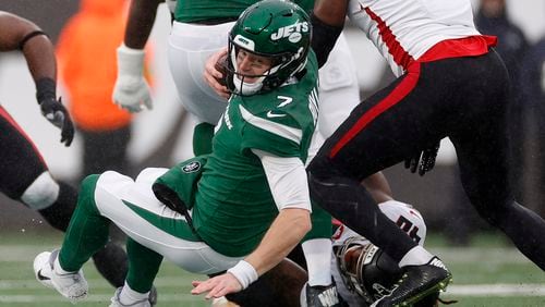 Tim Boyle (7) of the New York Jets is tackled by Keith Smith (40) of the Atlanta Falcons during the first quarter at MetLife Stadium on Dec. 3, 2023, in East Rutherford, New Jersey. (Sarah Stier/Getty Images/TNS)