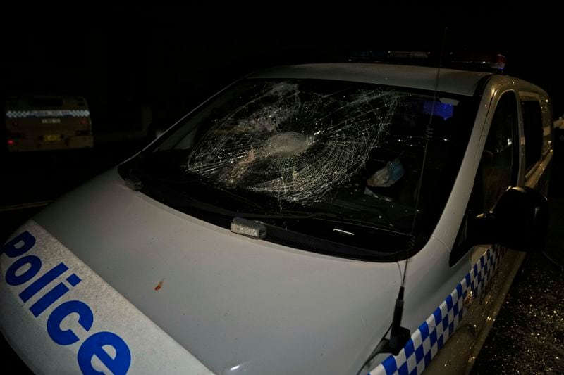 A Police car is seen vandalised outside a church where a bishop and churchgoers were reportedly stabbed in Sydney Australia, Thursday, May 25, 2023. (AP Photo/Mark Baker)