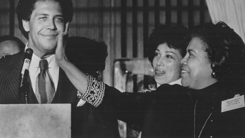 In the 1970s, Maynard Jackson is pictured here getting a love pat from his mom. AJC FILE PHOTO