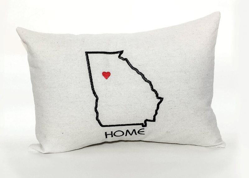 Garage Door Studio sells several Georgia-themed pillows and other locally made products. CONTRIBUTED