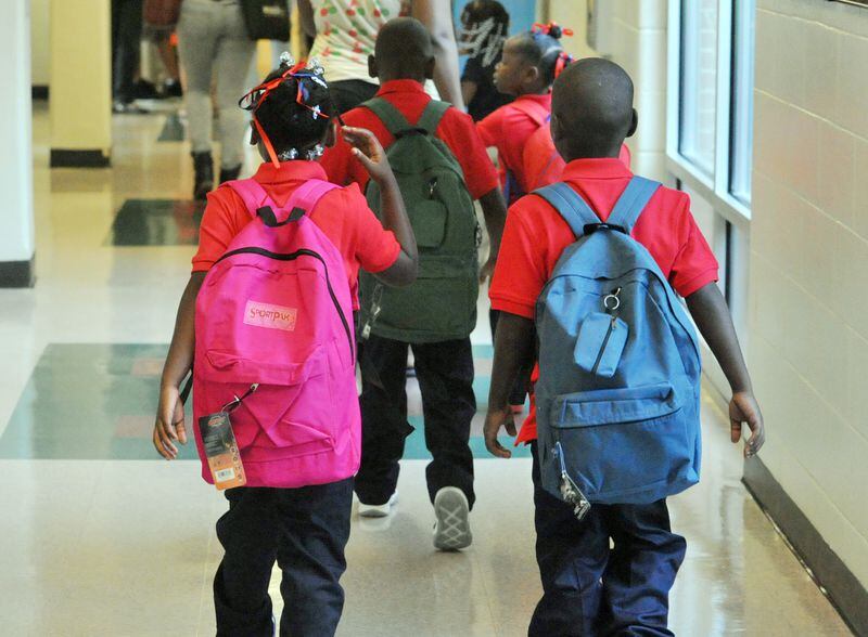 AUGUST 4, 2014 ATLANTA Students walk to classes as they start back to school at Bethune Elementary School in Atlanta on the first day of classes, Monday August 4, 2014. APS Superintendent Meria Carstarphen greeted students, parents, faculty and staff during the morning. KENT D. JOHNSON/KDJOHNSON@AJC.COM