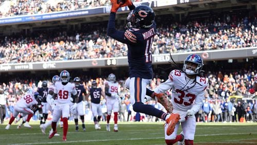 Chicago Bears wide receiver Darnell Mooney (11) makes a touchdown reception against New York Giants cornerback Aaron Robinson (33) in the first quarter, Jan. 2, 2022, at Soldier Field. (Brian Cassella/Chicago Tribune/TNS)