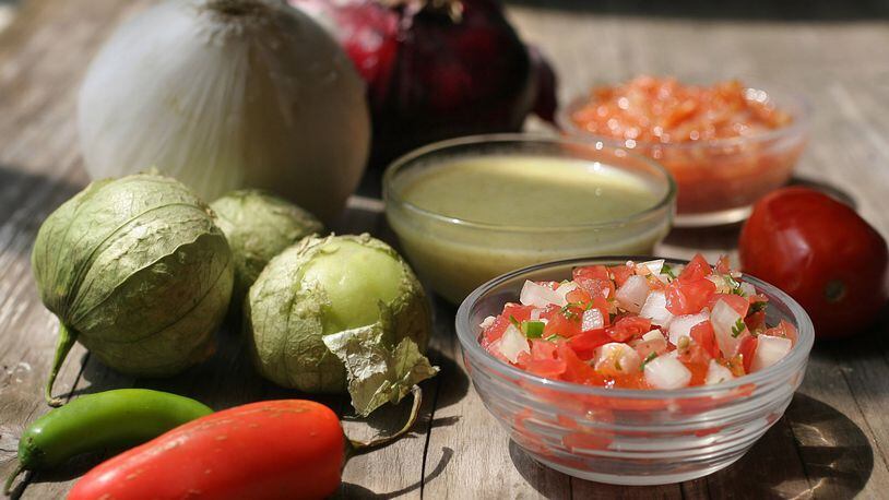 Homemade salsas are easy to make and use fresh in-season ingredients. Pictured from front to back: pico de gallo, salsa verde, and Olivia’s salsa. (Hillary Levin/St. Louis Post-Dispatch/TNS)