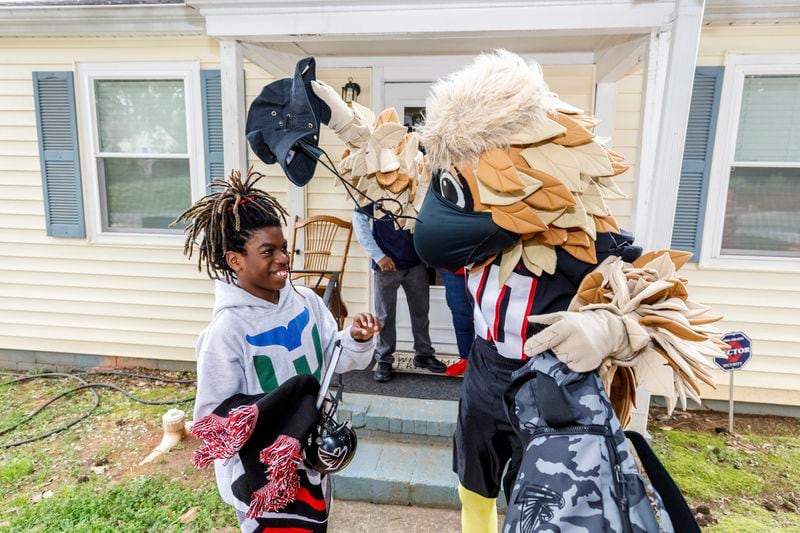 Freddie Falcon, the team mascot, stopped by to see Taeden Johnson of Athens, who recently lost his family members in a house fire. (Courtesy of the Atlanta Falcons).