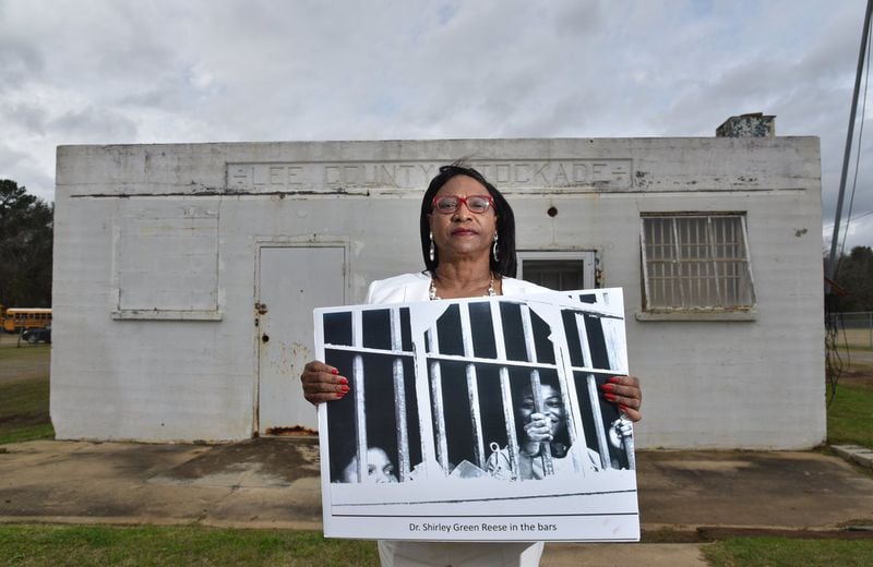 Shirley Green Reese holds a photograph of her inside the Leesburg Stockade building, where 15 girls ages 12-15, including her, were arrested and illegally held for more than two months in 1963 after a peaceful civil rights march in Americus. Reese has dedicated herself to sharing the story of the girls of Leesburg Stockade. 