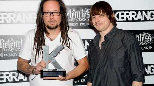 Jonathan Davis of Korn (left) poses with the Hall of Fame Award.