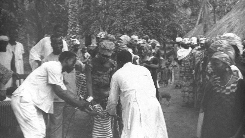 Dr. Bill Foege of Atlanta was instrumental in eliminating smallpox from the world, spending years working in Africa and other nations. Here, health workers in Nigeria in 1968 vaccinate a child against smallpox. Foege wants dozens of local organizations such as the CDC, CARE and Carter Center to coordinate efforts and wants the region to take on the role of a world health capital. Courtesy of the CDC