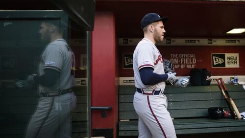 Braves first baseman Freddie Freeman walks through the dugout May 10, 2019, at Chase Field in Phoenix.