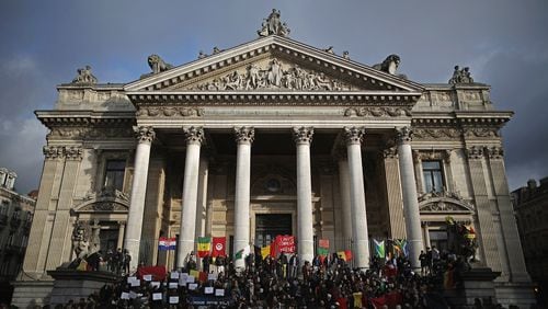 BRUSSELS, BELGIUM - MARCH 23: People chant and sing songs at the Place De La Bourse in honour of the victims of yesterdays' terror attacks on March 23, 2016 in Brussels, Belgium. Belgium is observing three days of national mourning after 34 people were killed in a twin suicide blast at Zaventem Airport and a further bomb attack at Maelbeek Metro Station. Two brothers are thought to have carried out the airport attack and an international manhunt is underway for a third suspect. The attacks come just days after a key suspect in the Paris attacks, Salah Abdeslam, was captured in Brussels. (Photo by Christopher Furlong/Getty Images)