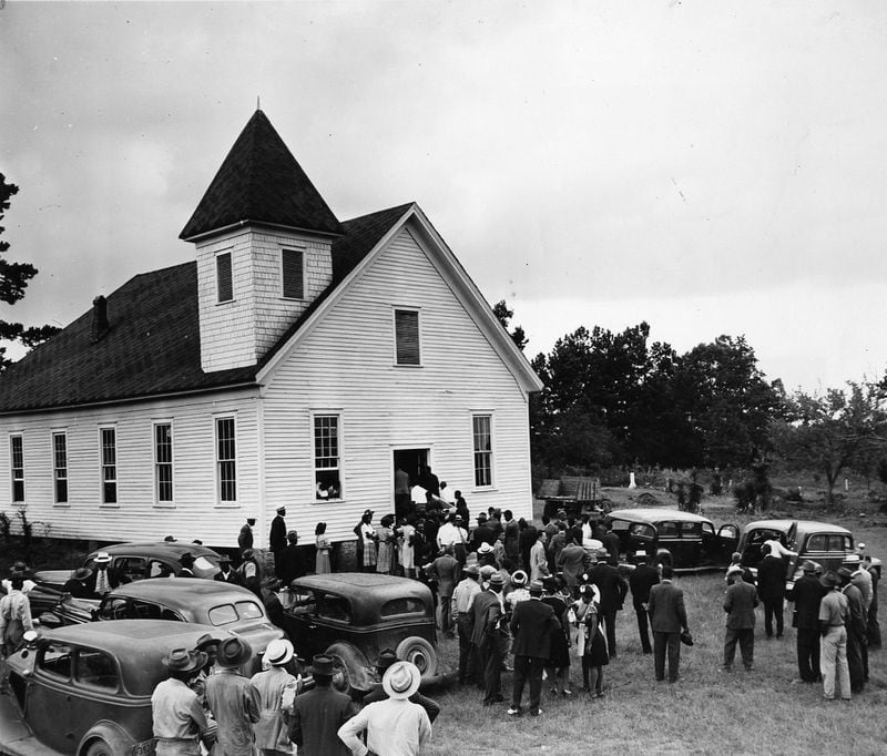 A crowd gathers at the Mt. Perry church near Monroe, Ga., for funeral services July 28, 1946, for George Dorsey and Dorothy Malcom, bother and sister, two of the four victims of a lynch mob. (Associated Press photo)