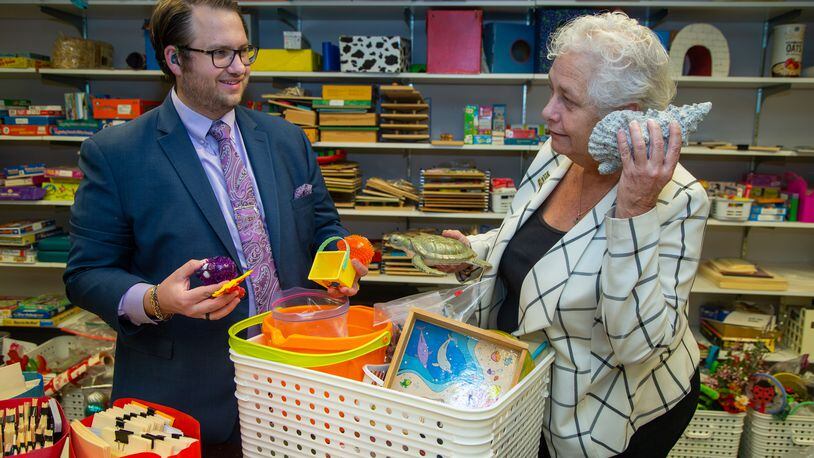 Jonathan Brilling and his mother Debbie go through therapy toys used at the Auditory-Verbal Center in Atlanta.  PHIL SKINNER FOR THE ATLANTA JOURNAL-CONSTITUTION.