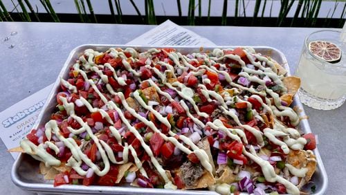 Chef Kevin Gillespie’s sheet tray nachos at Slabtown Public House.
Angela Hansberger for The Atlanta Journal-Constitution