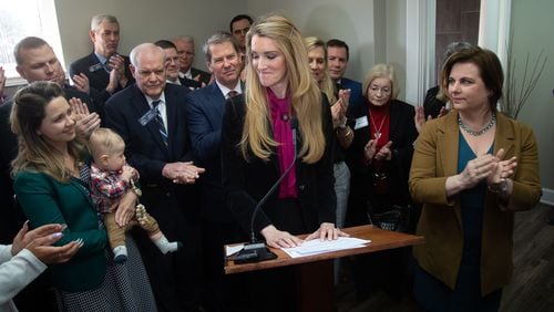U.S. Senator Kelly Loeffler joined by Gov. Brian Kemp and Susan B. Anthony List President Marjorie Dannenfelser (R) speaks during a press conference at the First Care Women's Clinic in Marietta Friday, February 14, 2020.   (Steve Schaefer for The Atlanta Journal-Constitution)