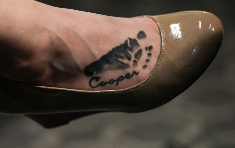 Cooper Harris’ name and footprint are tattooed into Leanna Harris’ instep. Cooper was 22 months old when he died in June 2014. (Branden Camp / For the AJC)
