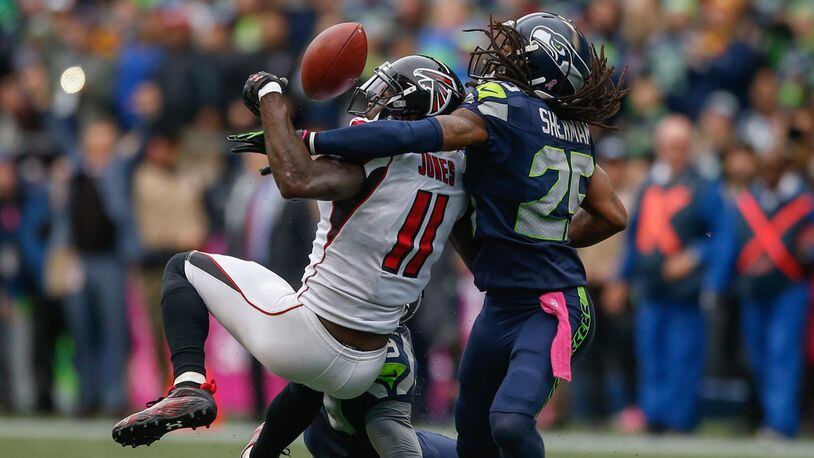 Falcons wide receiver Julio Jones can't make the catch on fourth down as Seattle cornerback Richard Sherman defends Oct. 16, 2016, at CenturyLink Field in Seattle.