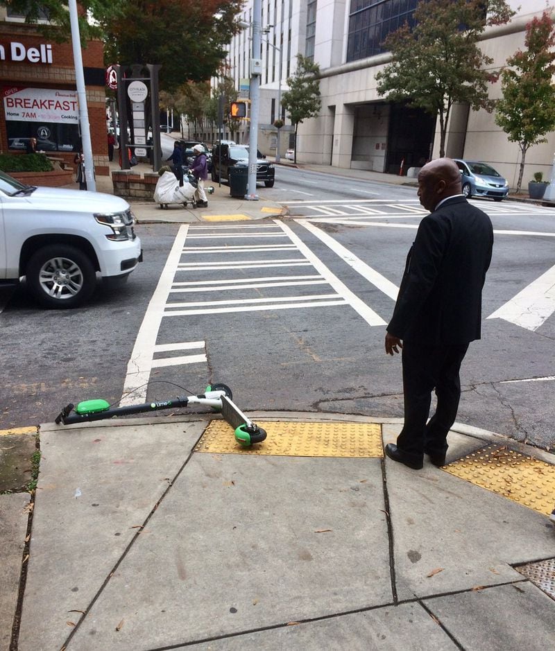 You’ll find scooters “parked” at the darnedest places in Atlanta, such as this one at a crosswalk next to City Hall. 