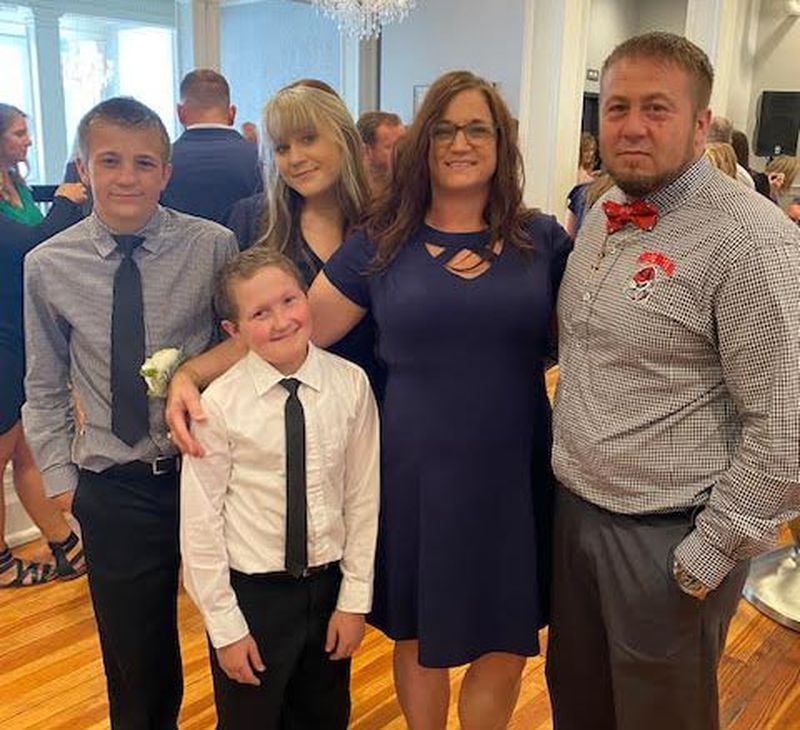 The Tanner family of Atkinson has battled childhood cancer for years. 16-year-old Gage, second from left, was diagnosed as a child with a brain tumor. And although drugs have stabilized the tumor, Gage's parents Candace and Michael, at right, have been left with significant expenses. (Contributed photo)