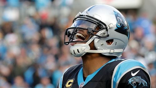 Panthers quarterback Cam Newton reacts after scoring the game winning touchdown against the Tampa Bay Buccaneers Sunday, Dec. 24, 2017, at Bank of America Stadium in Charlotte.