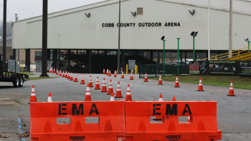 March 17, 2020 Marietta: Health department officials are setting up for the drive-thru testing of coronavirus in Jim Miller Park at the Cobb County Outdoor Arena on Tuesday, March 17, 2020, in Marietta. Curtis Compton ccompton@ajc.com