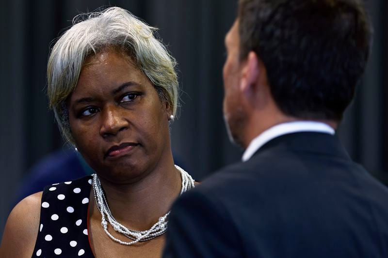 Councilwoman Catherine Rowell chats with Atlanta City Council President Doug Shipman following a crime and public safety summit at Atlanta Metropolitan College on Wednesday, June 15, 2022. (Natrice Miller / natrice.miller@ajc.com)

