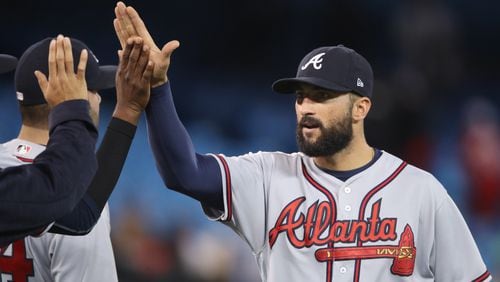Nick Markakis of the Atlanta Braves celebrates their victory with teammates during MLB game action against the Toronto Blue Jays at Rogers Centre on May 15, 2017 in Toronto, Canada. (Photo by Tom Szczerbowski/Getty Images)