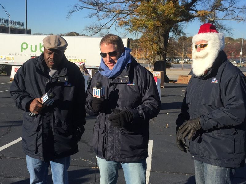 Chesley McNeil, Vinnie Politan and Chris "Crash" Clark in Santa gear at the 11Alive Can-a-thon at Turner Field. CREDIT: Rodney Ho/rho@ajc.com