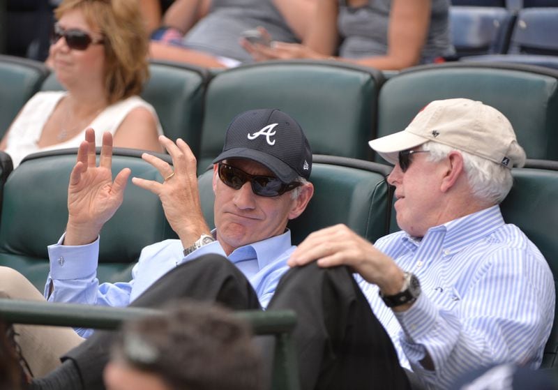 Liberty Media CEO Greg Maffei (left) and Braves chairman  Terry McGuirk talk during a game at Turner Field in 2016.