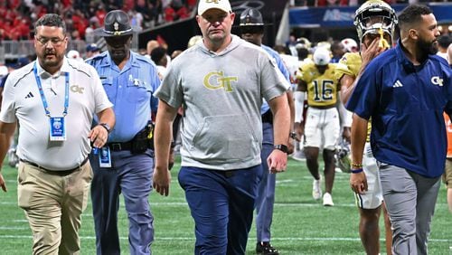 Georgia Tech's head coach Brent Key leaves the football field after Louisville defeat Georgia Tech during the inaugural Aflac Kickoff Game at Mercedes-Benz Stadium, Friday, September 1, 2023, in Atlanta. Louisville won 39-34 over Georgia Tech. (Hyosub Shin / Hyosub.Shin@ajc.com)