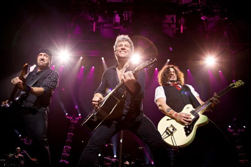  Jon Bon Jovi, center, performs on stage with his Bon Jovi band mates John Shanks, left, and Phil X during opening night of the band's "This House is Not For Sale" tour at the Bon Secours Wellness Arena in Greenville, SC. Photo by David Bergman / TourPhotographer.com
