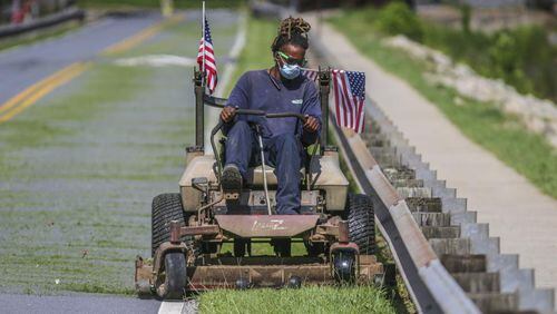 Fayette County has revised its 2018 grass-mowing plan to improve maintenance along major highways. AJC file photo