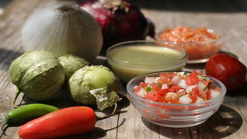 Homemade salsas are easy to make and use fresh in-season ingredients. Pictured from front to back: pico de gallo, salsa verde, and Olivia's salsa. (Hillary Levin/St. Louis Post-Dispatch/TNS)