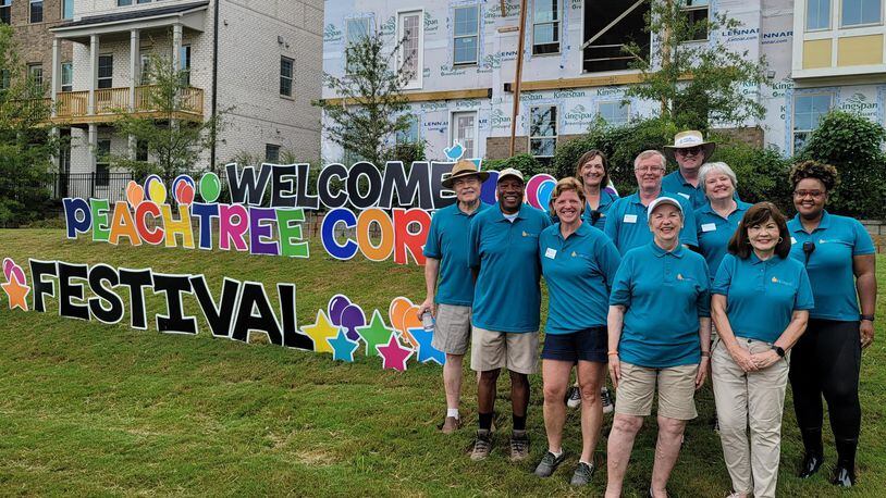 The Peachtree Corners Festival returns this year to Sept. 23-24 and will honor its founder and First Lady of Peachtree Corners, Debbie Mason (shown in photo center with white cap). COURTESY PEACHTREE CORNERS FESTIVAL