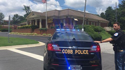 Authorities are investigating a bomb threat at the same Cobb bank that was the site of a deadly standoff earlier this month. (Credit: Channel 2 Action News)