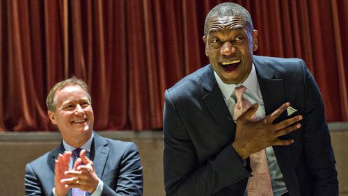 September 1, 2015 Atlanta - Dikembe Mutombo (right) reacts to the announcement that his jersey number will be retired on November 24 as Atlanta Hawks coach Mike Budenholzer claps during the celebration naming September 1 as Dikembe Mutombo Day in Fulton County at the Fulton County Government Center in Atlanta on Tuesday, September 1, 2015. JONATHAN PHILLIPS / SPECIAL