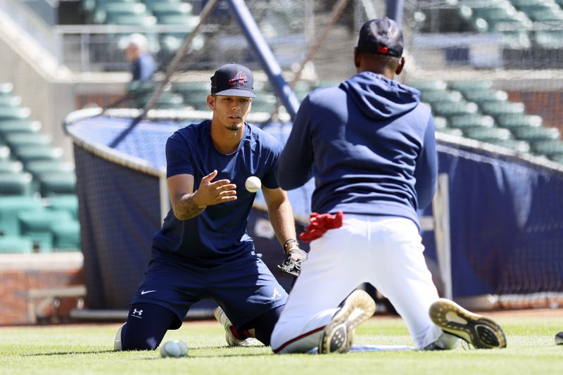 Braves third base coach Ron Washington (right) works with shortstop Vaughn Grissom on a drill before the game against the Houston Astros at Truist Park, Sunday, April 23, 2023, in Atlanta. Miguel Martinez / miguel.martinezjimenez@ajc.com 