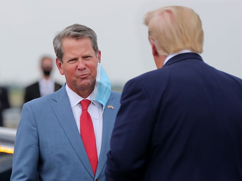 Gov. Brian Kemp, shown greeting President Donald Trump during a July visit to Georgia, expresses optimism about the president's chances in the state in November's election against the Democratic ticket of Joe Biden and Kamala Harris. “Here’s my prediction: Just like voters rejected Stacey Abrams because she was too extreme, they will also reject Biden and Harris in November,” Kemp said.  Curtis Compton ccompton@ajc.com