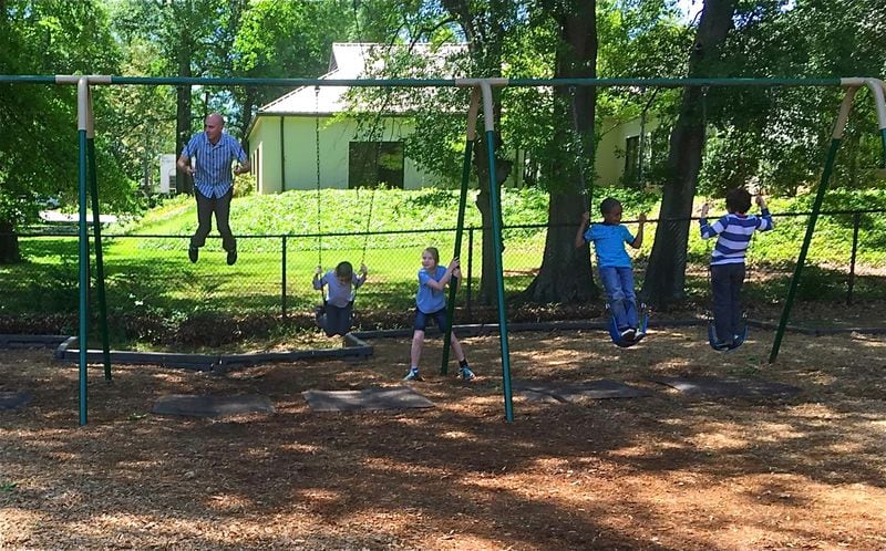 Cameron Brooks, third-grade teacher extraordinaire at Chase Street Elementary School in Athens, believes play is an integral part of his children's day and joins them on the playground.