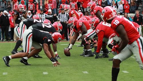 The Red and the Black face off at the line of scrimmage during Georgia's annual G-Day football game on Saturday, April 20, 2019, in Athens.    Curtis Compton/ccompton@ajc.com