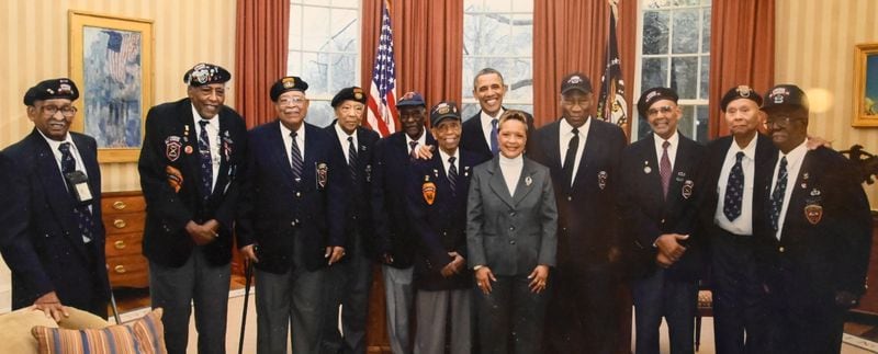 (**PHOTOGRAPH PROVIDED BY Daniel Boatwright) Dan Boatwright (second from right) with President Barack Obama. Daniel Boatwright is one of the oldest surviving members of the 555th paramilitary infantry division, also known as the Triple Nickles.
