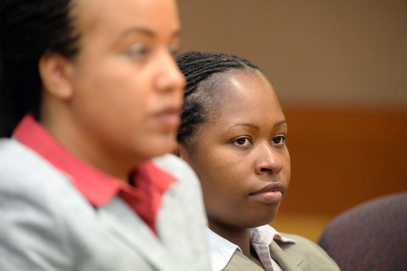 LAST APS EDUCATOR SENTENCED--SEPTEMBER 1, 2015 ATLANTA Former APS Dunbar Elementary teacher Shani Robinson listens to appeals in her case during sentencing. The final defendant in the Atlanta Public Schools test-cheating trial appears for sentencing before Judge Jerry Baxter in Fulton County Superior Court, Tuesday, September 1, 2015. Former APS Dunbar Elementary teacher Shani Robinson's sentencing was delayed from April because she gave birth to a son. Fulton County Superior Court Judge Jerry Baxter sentenced her to 1 year of prison. Judge Baxter will also address the issues of two other former educators -- Armstead Salters and Sheridan Rogers -- who did not testify as they had promised when they struck a deal with prosecutors. (Atlanta Journal-Constitution, Kent D. Johnson, Pool)