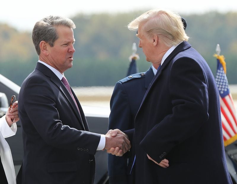 Georgia Gov. Brian Kemp greets President Donald Trump at Dobbins Air Force Base on Nov. 8, 2019, in Marietta. (Curtis Compton/ccompton@ajc.com)