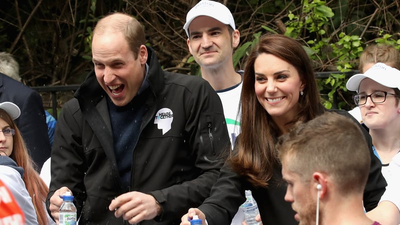Prince William, with Kate by his side, laughs it off after a runner squirted water his way during Sunday’s London Marathon.