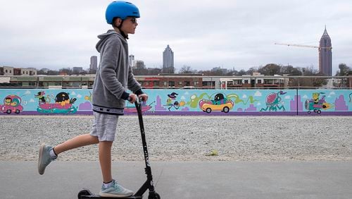 12/27/2018 -- Atlanta, Georgia -- A child scoots along the Atlanta Beltline during a cool, cloudy afternoon in Atlanta, Thursday, December 27, 2018. Rain is in the forecast for late Thursday afternoon and evening in metro-Atlanta. "With 1-3 inches, there will be ponding on the roadways and also the potential for some of those creeks, rivers and streams to continue to climb, seeing as they are already fairly high," Channel 2 meteorologist Katie Walls said. Rain is forecasted to linger in metro-Atlanta, on and off, through the New Year. The National Weather Service has issued a flash flood watch for all of North Georgia scheduled to go into effect at 7 p.m. Thursday and expire at 7 a.m. Saturday. (ALYSSA POINTER/ALYSSA.POINTER@AJC.COM)