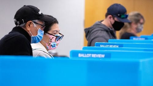 Voters cast their ballots at the Gwinnett County Department of Water Resources in Lawrenceville, Ga., on Tuesday, Nov. 3, 2020. (Casey Sykes for The Atlanta-Journal Constitution)