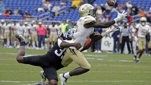 Georgia Tech wide receiver Adonicas Sanders (12) hauls in a pass for what proved to be the winning touchdown against Duke cornerback Jeremiah Lewis (39) during the second half of an NCAA college football game in Durham, N.C., Saturday, Oct. 9, 2021. (AP Photo/Chris Seward)