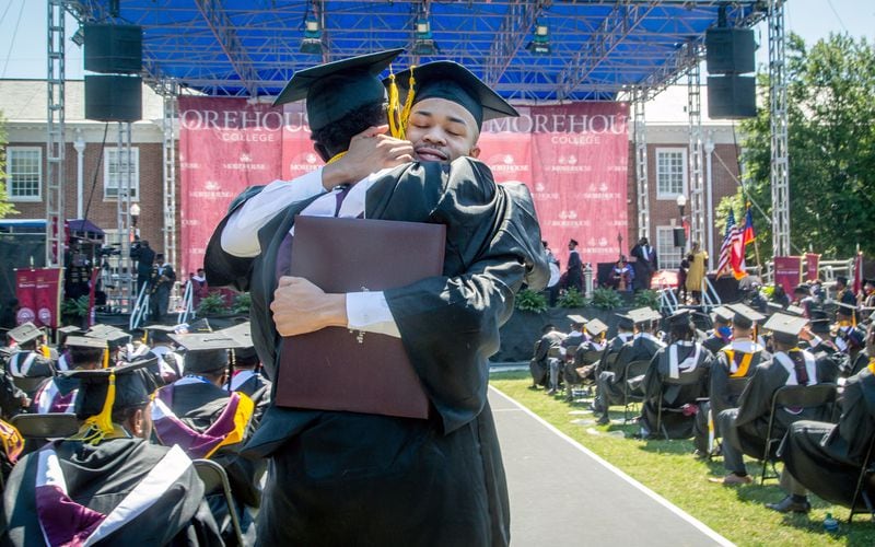Graduates react after receiving their diploma during the 137th commencement that celebrates the classes of 2020 and 2021 on the Century Campus at Morehouse College on Sunday, May 16, 2021. Morehouse is the nation's only college dedicated specifically to educating Black men. (Steve Schaefer for The Atlanta Journal-Constitution)