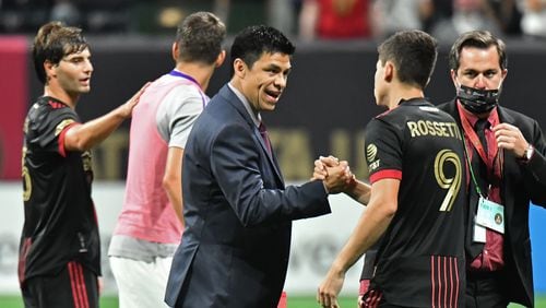September 10, 2021 Atlanta - Atlanta United head coach Gonzalo Pineda celebrates with Atlanta United's midfielder Matheus Rossetto (9) after they won over Orlando City in a MLS soccer match at Mercedes-Benz Stadium in Atlanta on Friday, September 10, 2021. Atlanta United won 3-0 over Orlando City. (Hyosub Shin / Hyosub.Shin@ajc.com)